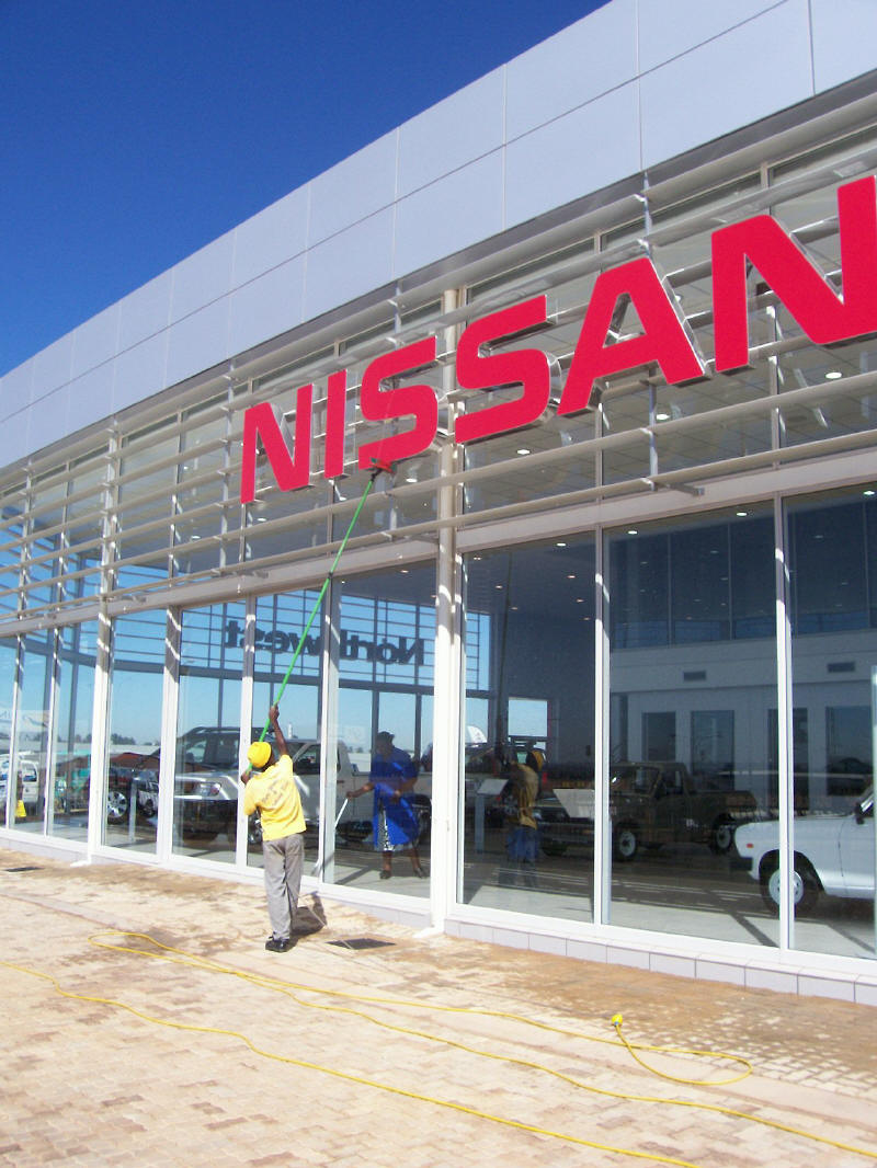 Cleaning signage & cladding at Nissan